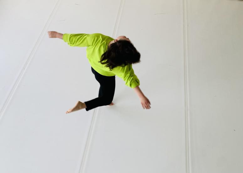 Leo Terävä jumping with arms and legs spread wide.