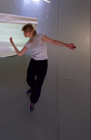 Photo: Eeva Juutinen in an white space dancing