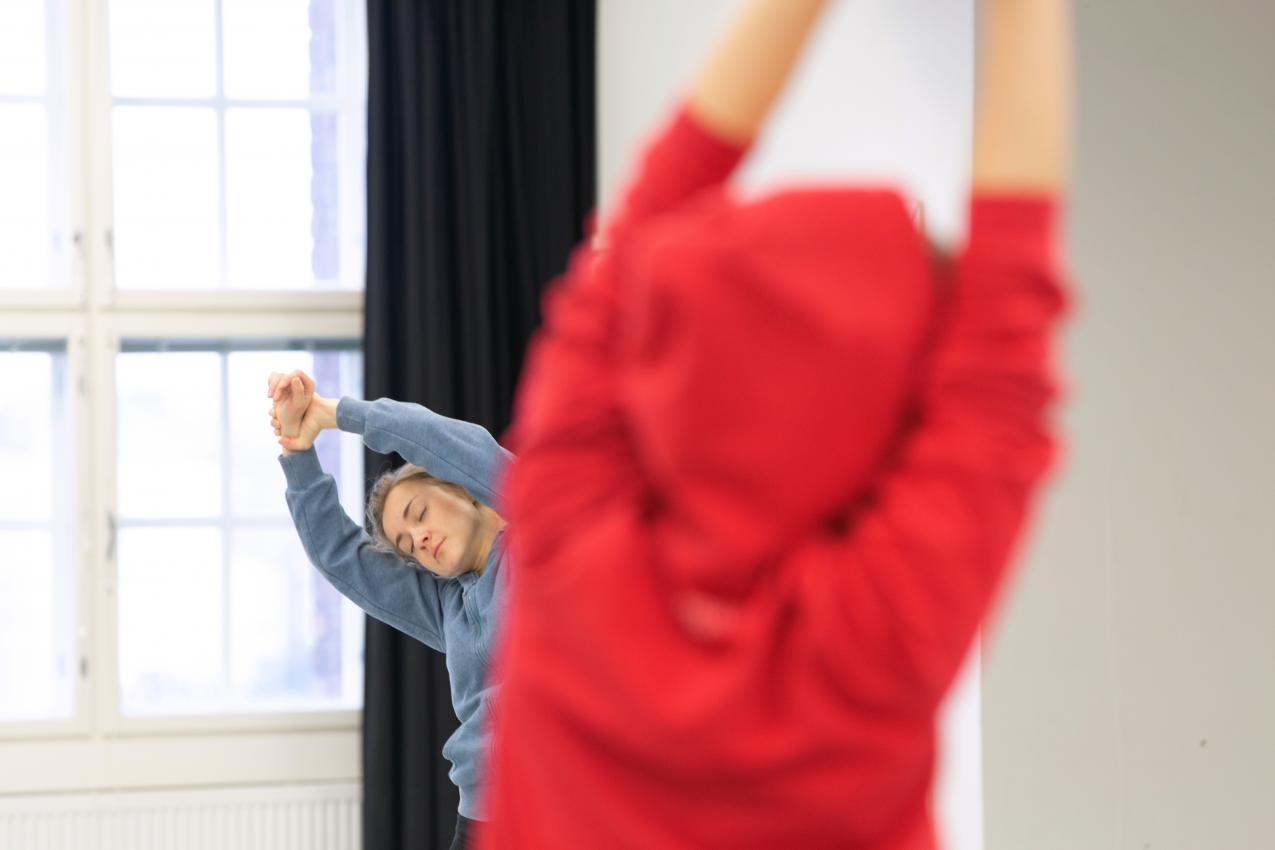 Two person stretching in the dance studio