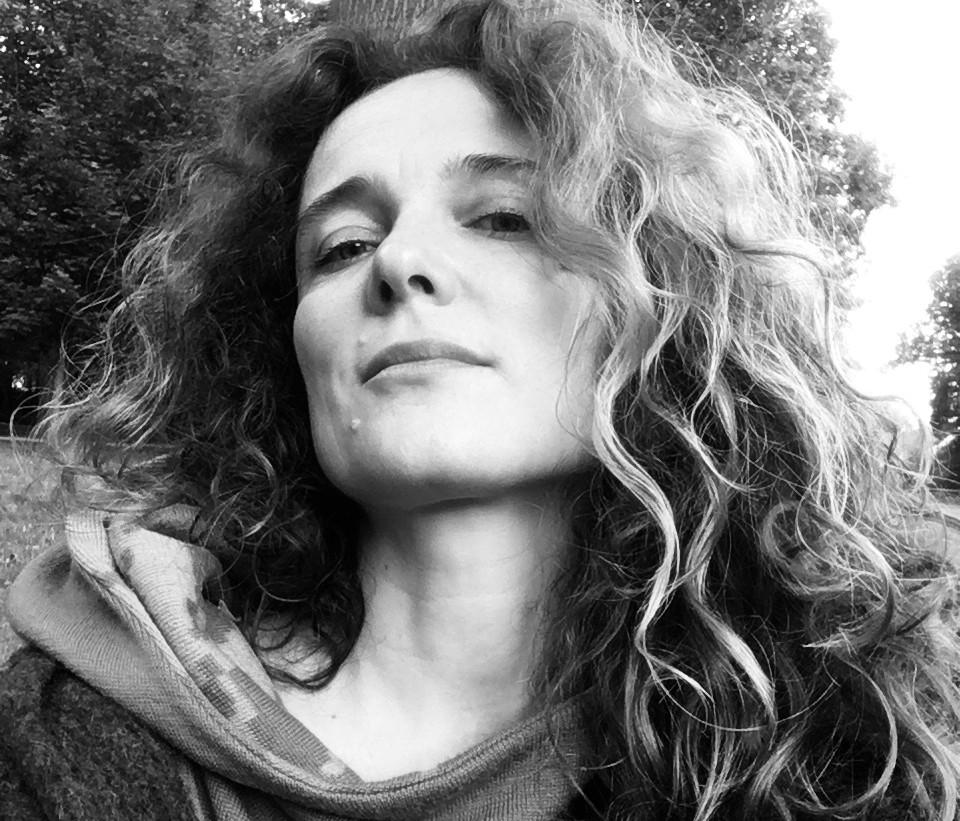 Headshot of curly haired Dorte Bjerre Jensen