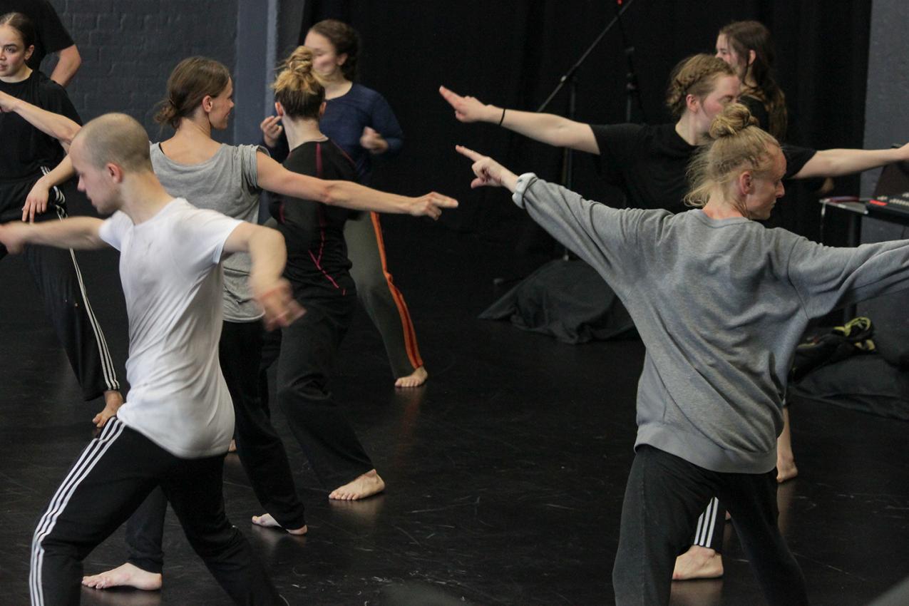 Sweaty people dancing in a dance studio