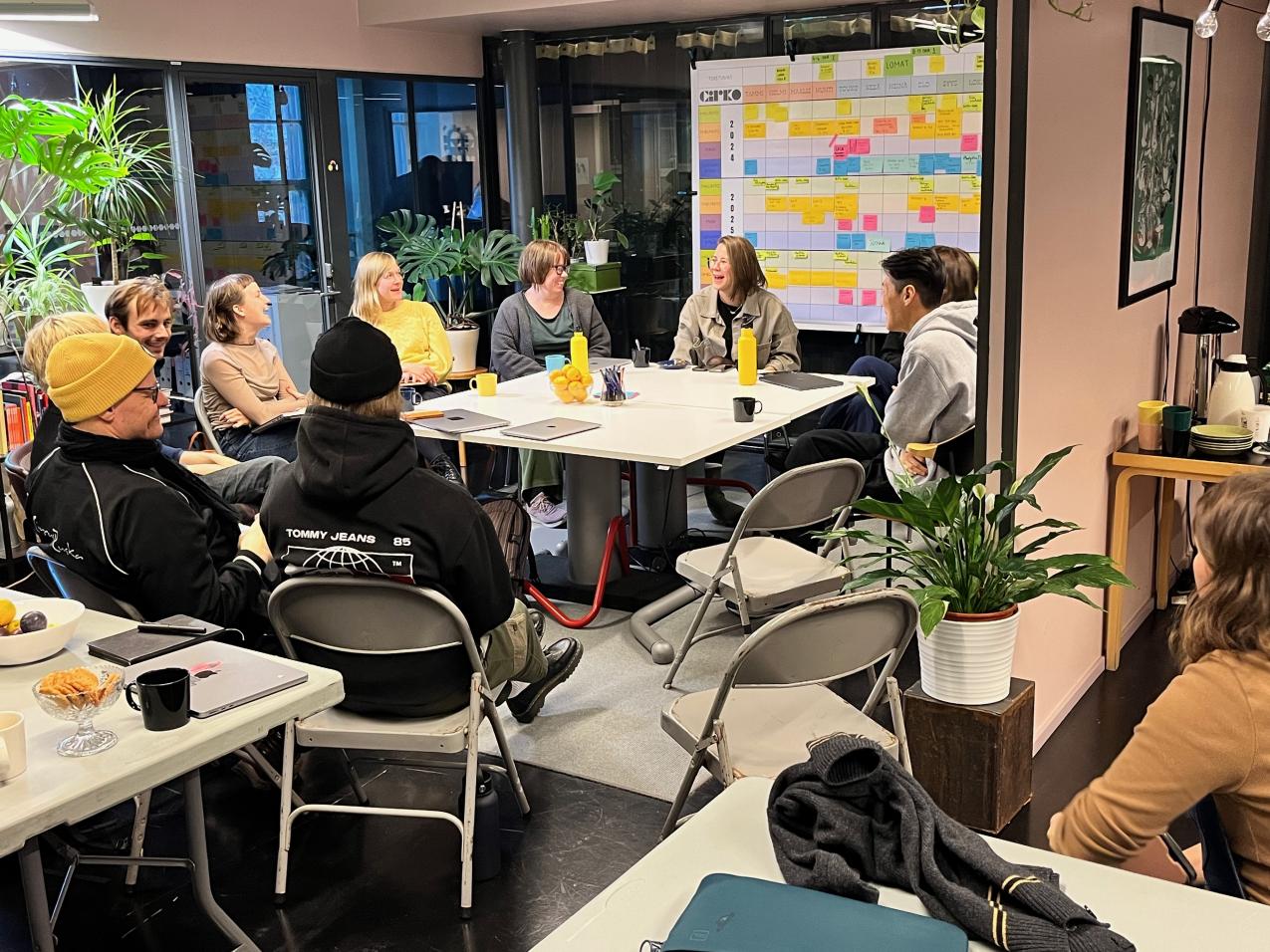 People at Cirko's office. They are sitting in a circular formation.