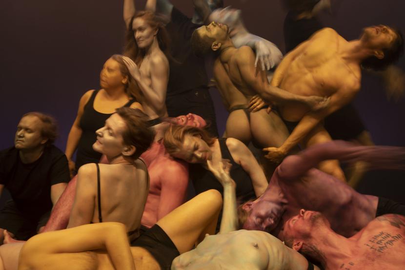 Performers creating a massive pile.