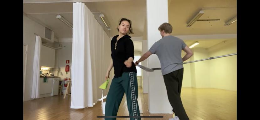 A panorama photo from a rehearsal space. In the photo are Marika Peura and Arttu Palmio.
